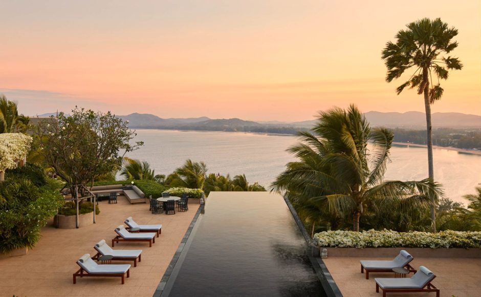 Infinity-edge pool and sun loungers looking out over the sea at Amanpuri, Phuket