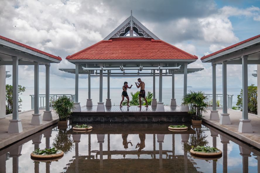 Two guests training in a pavilion above the Andaman Sea at Amatara Welleisure Resort, Phuket