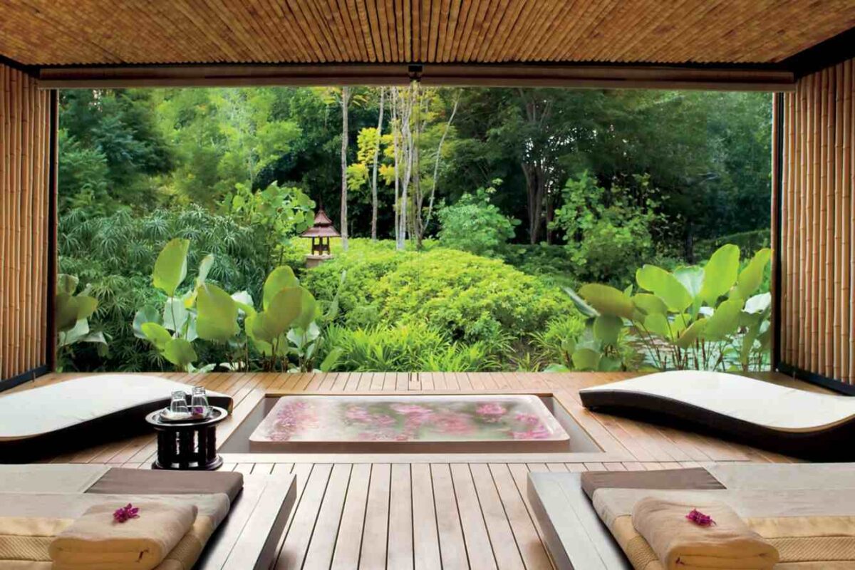 An open-air treatment room looking onto lush garden at The Spa at Phulay Bay, Krabi